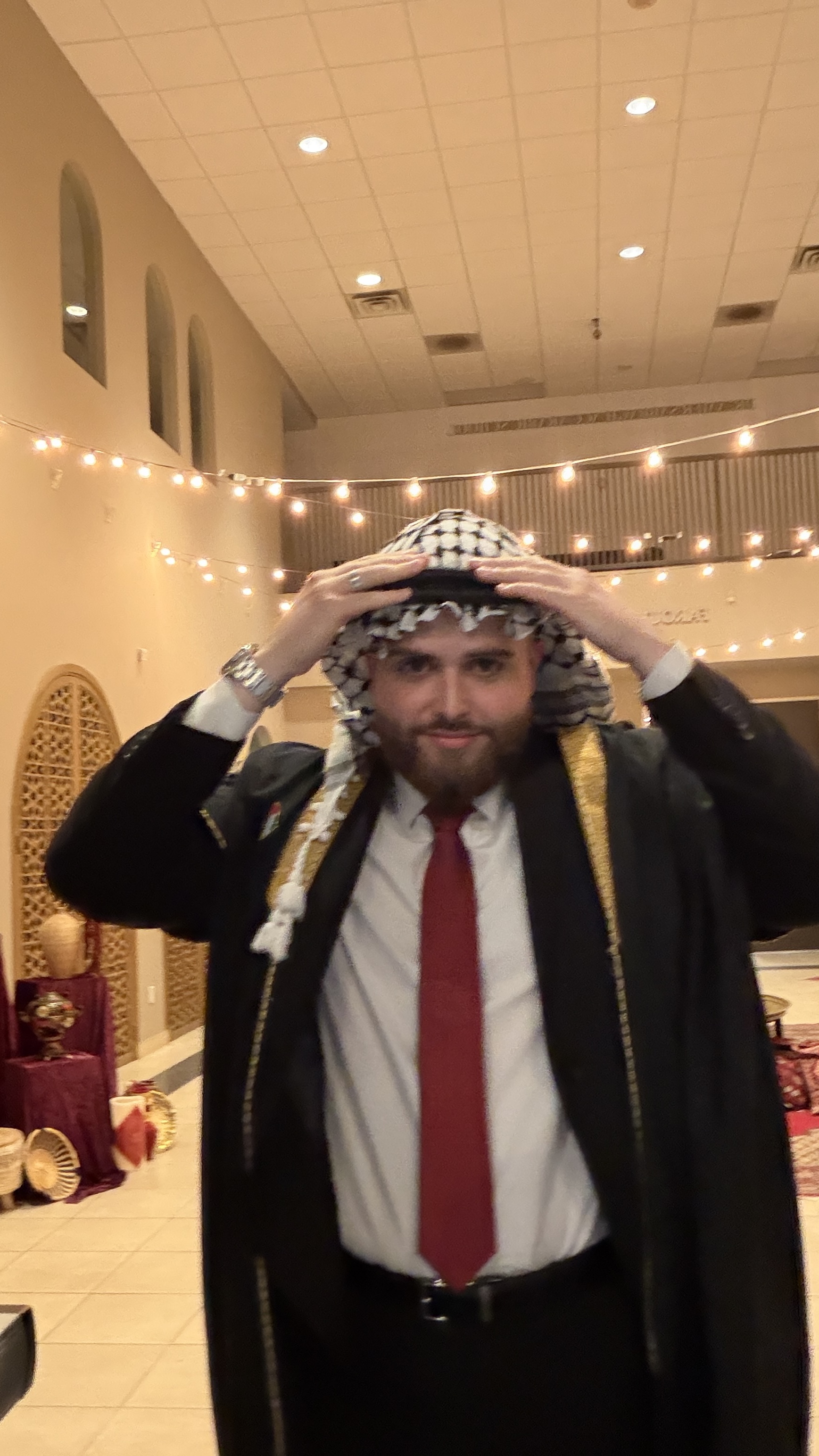 Groom in keffiyeh at henna night